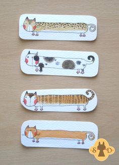 three bookmarks with cats and dogs on them