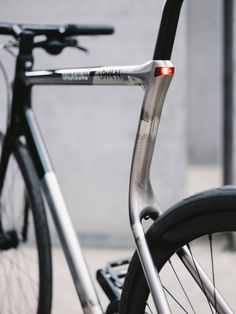 the front end of a bicycle with its brake lights on