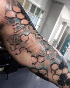 a man's arm with some chemical symbols on it