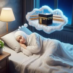 a woman laying in bed under a blanket with an image of the kabab above her head