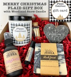 the christmas gift box includes an assortment of handmade soaps, lip bales and candles