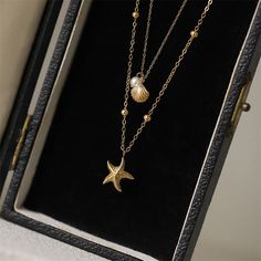 Description & Details Embrace the beauty of the sea with our meticulously crafted pieces that capture the essence of starfishes in stunning detail. From elegant starfish pendants to intricate starfish necklaces, our collection offers a range of styles to suit your unique taste. • Material: High Quality Titanium Steel• Finish: Hypoallergenic ∙ Gold Plating•Dimensions: 46 - 51 cm chain , adjustable• All our work is custom made by hand with love Shiny Jewelry, Starfish Pendant, Stacked Necklaces, Starfish Necklace, Layering Necklace, Shell Pendant, Steel Necklace, Shell Necklaces, Trendy Jewelry