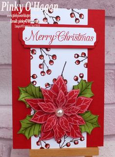 a red and white christmas card with poinsettis on it's side