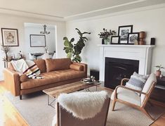 a living room filled with furniture and a fire place