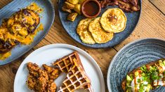 three plates with different types of food on them, including waffles and eggs