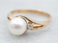 Anniversary Yellow Gold Pearl Ring With Diamond, Classic Pearl Ring With Single Diamond, Classic Pearl Ring With Single Diamond For Anniversary, White Pearl Ring With Single Diamond For Anniversary, Classic Yellow Gold Pearl Ring With Diamond, Elegant White Pearl Ring With Single Diamond, Classic Yellow Gold Pearl Ring With Single Diamond, Classic Formal Pearl Ring With Single Diamond, Classic Pearl Ring With Single Diamond For Formal Occasions