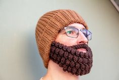 A handmade crochet winter hat with beard made from natural materials. These unusual but very warm accessories can be a great gift for any sports lover or just stylish person.  I make and send each beard and hat from harsh and frosty country where people know a lot about warming in winter time. Therefore each product is soft, warm and completely fit for everyday use.  Available 4 different sizes and many interesting models in my shop, but you should know that I love custom orders and always ready to realize something new. So feel free to contact me at any time! Crochet Beard, Crochet Winter Hat, Crochet Winter Hats, Crochet Winter, Knitted Beanie, Sports Lover, Winter Beanie, Crochet Hat, Winter Hat