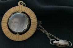 "Vintage 1980s Elvis medallion-pendant has a special feature, it spins. On one side is a black and white picture of Elvis and when you spin it to the opposite side it says, King of Rock, Elvis, 1935 - 1977.  The vintage 1980s Elvis spinning medallion-pendant is 1.5\" around and the 18\" chain is included.  Free Shipping in the Continental USA." Retro Engraved Jewelry For Collecting, Vintage Medallion Necklace With Round Pendant, Vintage Style Medallion Necklace With Round Pendant, Vintage Medallion Necklace With Locket, Vintage Round Pendant Medallion Necklace, Vintage Metal Medallion Necklace As A Gift, Vintage Coin Medallion Necklace, Vintage Engraved Medallion Necklace, Retro Engraved Collectible Jewelry