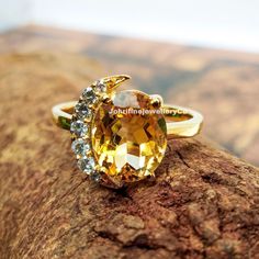 "Citrine ring - November Birthstone - Statement Ring - Gold Ring - Engagement Ring - Prong Ring - Oval Ring - Cocktail Ring - Statement Ring Specifications :- ❥ Stone - Natural Citrine ❥ Stone Size - 7x9mm ❥ Cut Type - Oval ❥ Side Stones- Simulated diamonds Cz ❥ Ring Size: I offer more than one (Contact us if your ring size is not available in the listing) ❥ Color: Silver, Gold, Rose Gold, White Gold or Black Rhodium ❥ Material : 925 Sterling Silver, 14K/18K/22K Solid Gold --> ❥ Makes a Wonderfu Gold Ring Engagement, Prong Ring, Purple Amethyst Ring, Gold Statement Ring, Oval Ring, Citrine Ring, Citrine Stone, Oval Rings, Cubic Zirconia Rings