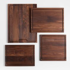 four square wooden trays with one on the left side and two on the right