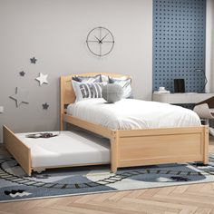 a bedroom with a bed, desk and chair in it's center area that has stars on the wall