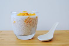 a spoon sitting next to a bowl of food