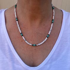 This Native American inspired beaded heishi necklace is made with natural white buffalo turquoise from Nevada, blue green turquoise, black onyx, and sterling silver spacer beads.  The beads are uniform in size, making for a clean flowing pattern of semi precious gemstones. Modeled in both 18" and 20". The AAA grade white buffalo turquoise beads are beautiful shades of gray and white polished to a fine quality semi gloss luster that compliments that of the green turquoise and black onyx.  White B White Buffalo Turquoise Jewelry Necklaces, Adjustable White Turquoise Necklace With Natural Stones, White Heishi Beads Hand-strung Necklaces, White Heishi Beads Necklaces Hand-strung, White Hand-strung Heishi Bead Necklaces, Bohemian Style Turquoise Gemstone Beads Necklace, White Heishi Beads Artisan Jewelry, White Turquoise Necklace With Natural Stones, Adjustable, Hand-strung White Heishi Bead Necklaces