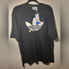 Nwt Adidas T Shirt Is Casual. You Wear It Out Or Wear It When You're Exercising. It Can Match Anything. It Says Size Small/ Medium, But It Can Fit Up To Large Because It's Supposed To Be Oversized. No Callouts If You Have A Question, Please Ask! If You Are Interested In Bundles, Send Me A Message About What Additional Item You Want. Adidas Three Stripes, Black And White Logos, Velvet Shorts, Adidas T Shirt, Adidas Originals Women, Sporty Casual, Blue Polo, Adidas Tops, Blue Adidas