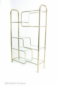 a gold metal rack with three shelves on each side