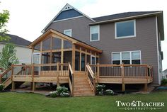 a house that has some stairs in front of it and a porch on the side