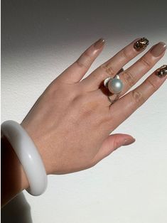 Welcome to AmberLirong!  ---------------------------------- Pearl type: Genuine South Sea Pearl, Silver white with warm glow The photoed and videoed item is the one you will take home.  Elevate your elegance with our unique South Sea pearl ring, featuring a 14mm round pearl with very high luster and minimal skin marks. The distinctive flow-shaped design, centered by the lustrous pearl, adds a touch of sophistication. Crafted with an adjustable S925 sterling silver shank, this ring combines style Fine Jewelry White Pearl Open Ring, White Pearl Open Ring Fine Jewelry, Fine Jewelry White Bangle, White Pearl Ring Fine Jewelry, Fine Jewelry White Pearl Ring With Round Band, White Dome Ring Fine Jewelry, White Pearl Ring With Round Band, White Pearl Open Ring, White Moonstone Open Ring