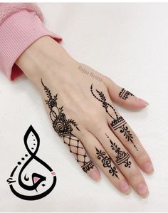 henna tattoo on the palm of a woman's hand