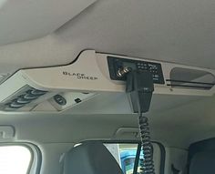 an electronic device connected to the back of a car