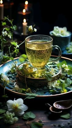 a cup of green tea on a plate with flowers