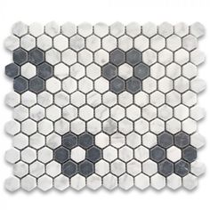 a white and black marble mosaic tile with hexagons