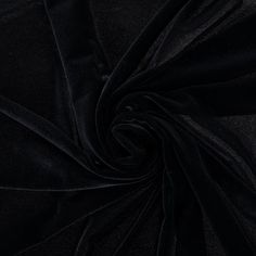 Give your next fabric creation a luxurious touch using Black Velvet Fabric. Perfect for accenting a wide variety of projects, this ultra-plush fabric will give you the feeling of ultimate sophistication. Its velvety surface is composed of a spandex blend, granting it superb pliability. Sew something creative and colorful to fit your needs and style!     Details:   Width: 58" - 60"  Weight: Medium Weight  Country Of Origin: Korea  Content: 90% Polyester & 10% Spandex  Care: Dry Clean Only.  F Black Velvet Wallpaper, Fabric Creation, Dupatta Draping, Draping Styles, Something Creative, Black Velvet Fabric, Silhouette Cameo Machine, Wedding Top, Print Coupons