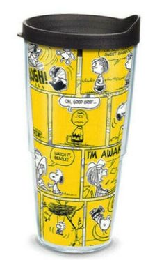 a yellow and black cup with cartoon images on the bottom, sitting in front of a white background