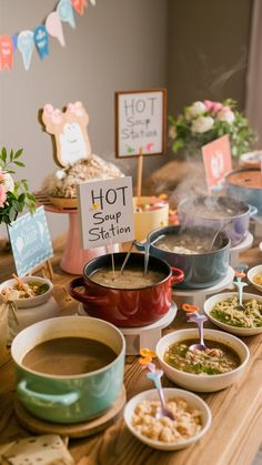 hot soup station with various bowls and plates on the table for guests to eat at