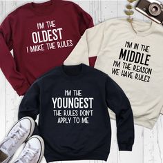 Humorous Siblings Rules Sweatshirts, Oldest Middle Youngest Funny Siblings Hoodie, Matching Family Tees,  Sister Brother Birthday Shirt Show off your sibling pride with our Humorous Sweatshirt collection, featuring Siblings Rules Sweatshirts for every family member! Whether you're the Oldest Hoodie wearer, the Middle Hoodie champion, or the Youngest Hoodie star, these Funny Siblings Shirts are perfect for adding laughter to your family gatherings. Perfect for Matching Family Tees, this collectio Oldest Middle Youngest Shirts, Cotton Sweatshirt For Birthday In Winter, Long Sleeve Fall Birthday Sweatshirt, Cotton Sweatshirt For Winter Birthday, Cotton Hoodie Top With Lettering, Long Sleeve Winter Birthday Sweatshirt, Birthday Long Sleeve Hoodie With Letter Print, Long Sleeve Hoodie With Letter Print For Birthday, Birthday Letter Print Long Sleeve Hoodie