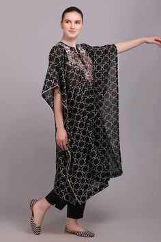 Black geometric printed kaftan with embroidered front, back yoke and laced sleeves border. Paired with a plain straight pant. - Aza Fashions Bohemian Kurta With Cape Sleeves For Eid, Bollywood Style Black Kaftan With Dabka, Black Bollywood Kaftan With Dabka, Traditional Tunic Kaftan With Printed Motifs, Festive Black Dabka Kaftan, Elegant Black Kaftan With Chikankari Embroidery, Festive Black Tunic Kaftan, Traditional Tunic With Kimono Sleeves, Embroidered Black Kaftan Bollywood Style