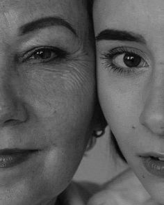 black and white photograph of two women with one woman's face close to the camera