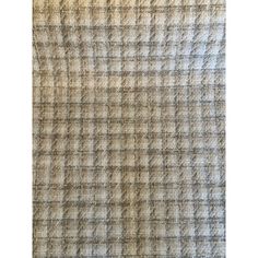 an old plaid fabric textured with grey and beige colors, suitable for background or wallpaper