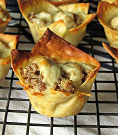 there are many small meat and cheese cups on the cooling rack, ready to be eaten