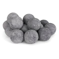 a pile of gray rocks sitting on top of a white floor next to each other