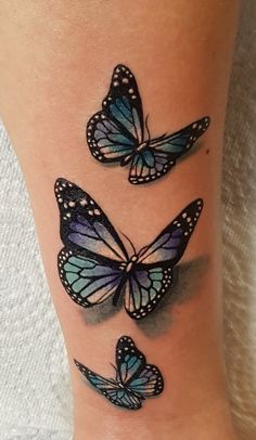 three blue butterflies on the ankle