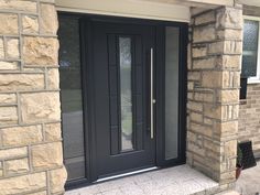 a black front door on a brick house