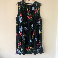 Great Staple Piece For Your Summer Wardrobe! This Black Sleeveless Dress Is Adorned With A Colorful Floral Print. Neckline Is A V With A Tie At The Base. Waistline Is Cinched Just Below The Bust To Give An Hourglass Shape. The Fabric Of This Dress Is Very Soft And Flowy. Condition Is New With Tags. Black Sleeveless Sundress For Daywear, Casual Black Sleeveless Sundress, Multicolor Sleeveless Sundress For Daywear, Black Floral Print Sleeveless Beach Dress, Navy Fall Dress, Petite White Dress, Green Halter Dress, Bright Floral Dress, Womens Navy Dress