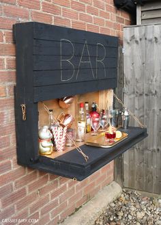 an outdoor bar with drinks on it