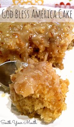 a close up of a piece of cake on a plate with a spoon in it