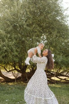 Cream cotton fabric with brown florals High ruffled neckline Long balloon sleeve with an elastic cuff Maxi length tiered skirt; lace ruffle on skirt Pull over style with a smocked bodice Maternity friendly Skirt lined Non-stretch fabric with stretch through smocked bodice matching mommy and me style flowy floral dresses, earthy tones, vintage-inspired layers, cottagecore accessories, soft autumn hues, cottagecore dress, fall dress, fall fashion, family photo, modest fashion, hijab fas Dress For Family Photos, Cottagecore Accessories, Flowy Floral Dress, Modest Fashion Hijab, Fashion Family, Cottagecore Dress, Soft Autumn, Ruffled Neckline, Fashion Hijab