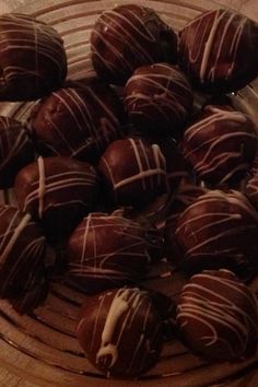 chocolate covered donuts are on a glass plate