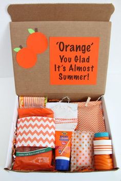 an orange box filled with lots of different items