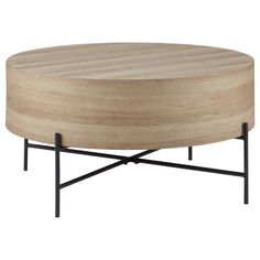 a round wooden table with black metal legs