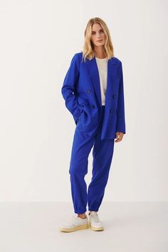 Double the cool, double the compliments. The oversized Sonjas Double-Breasted Blazer has a roomy, menswear-inspired shape and a bold, modern look—complete with cuff buttons and flap pockets that add the perfect amount of polish. Dressed up or down—get ready to do a double-take. Try the blazer paired with the coordinating KATJA TROUSER for a new spin on suiting! **Sizing notes: This style runs TTS MATERIALS: Self: 65% Polyester (Recycled), 33% Viscose, 2% Elastane Lining: 55% Polyester,45% Viscos Blazer Designs, Double Breasted Jacket, Breasted Blazer, Menswear Inspired, Double Breasted Blazer, Black Button, The Cool, Bright Blue, Rocker