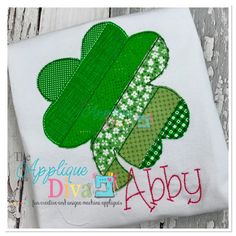 a st patrick's day shamrock applique on a white t - shirt