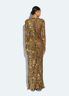 Featured in the Holiday 25 Collection Semi-sheer gown featuring beautiful abstract sequins. Sophisticated severe boatneck compliments the relaxed draping of this dress. Invisible zipper closure. Material: 100% Polyamide Care: Dry Clean Only Fit: True To Size. For a slimmer fit, size down Model is 5'10 and Wearing a size 2 Gown Gold, Sheer Gown, Sequin Gown, Denim Blazer, Dress Satin, Runway Collection, Event Dresses, Invisible Zipper, Gold Yellow