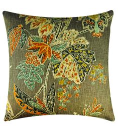 a decorative pillow with an orange, green and blue flower design on it's side