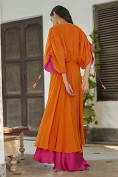 Shop for Betrue Orange Georgette Solid Gathered Maxi Dress for Women Online at Aza Fashions Navratri Dress With Back Tassel Tie-up, Traditional Dresses With Cape Sleeves For Summer, Traditional Summer Dresses With Cape Sleeves, Festive Silk Dress With Back Tassel Tie-up, Bohemian Tassel Dresses For Navratri, Silk Dress With Kimono Sleeves For Festivals, Silk Festival Dress With Kimono Sleeves, Elegant Festive Dress With Back Tassel Tie-up, Rani Pink Dress