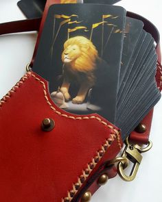 a bunch of cards sitting on top of a red bag