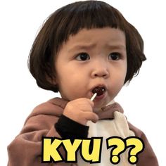 a young child brushing his teeth with the words kyu?